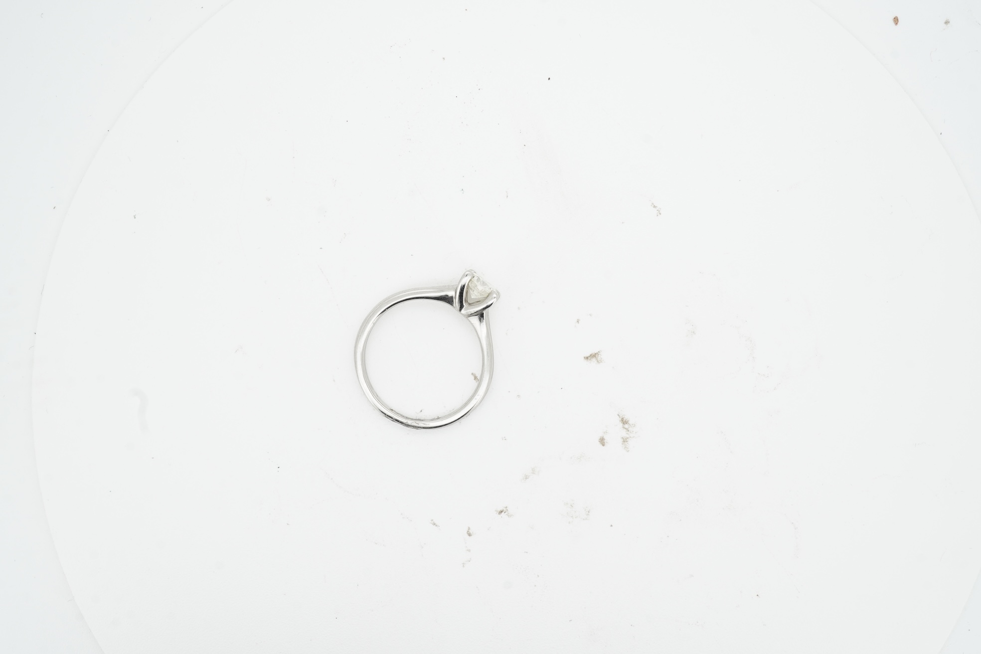 A diamond ring, claw-set with a brilliant-cut diamond weighing approximately 0.50 carats, mounted in platinum, size K, British hallmarks, gross weight approximately 4 grams